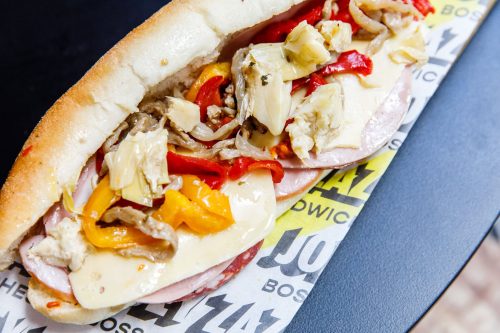 Joey Zaza's The Classic Conti brings ‘ya all authentic Italian cold cuts in one lunch sandwich: ham, sopressa, and mortadella! The meaty goodness of ‘ya favourite conti roll comes with Swiss cheese, roasted capsicum, and marinated veg. Of course, Joey Zaza’s continental roll ain't complete without a helping of sweet tangy ajvar and creamy butter.